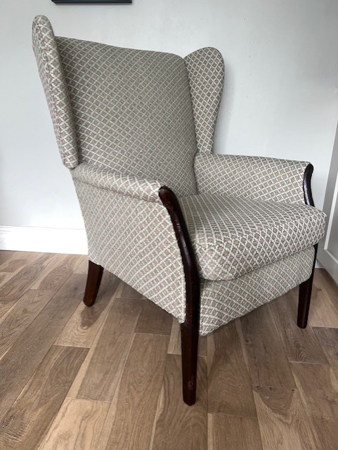 Reupholstered wingback armchair in patterned fabric